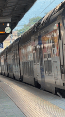 Double-decker train stopped at Ventimiglia station