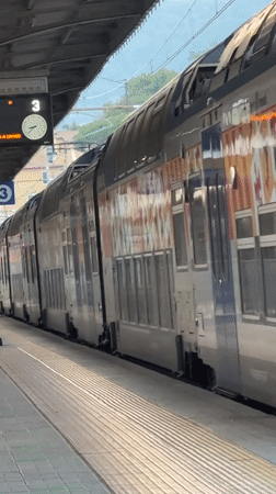 Double-decker train stopped at Ventimiglia station