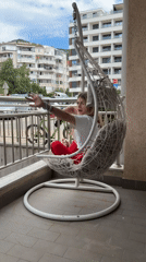 Woman enjoys morning moments on Budva balcony, takes selfie