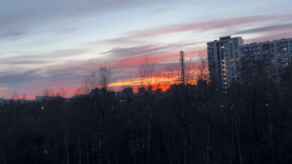 Resident documents Kudrovo cityscape and anime art during evening hours