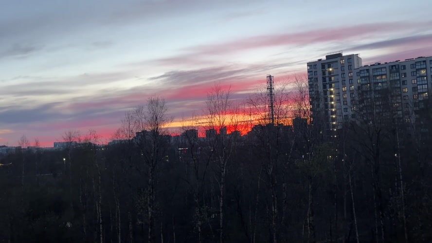 Resident documents Kudrovo cityscape and anime art during evening hours