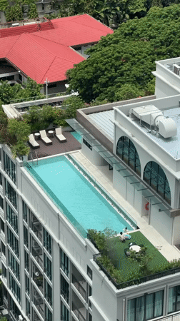 Rooftop pool with lounge chairs spotted in Bangkok