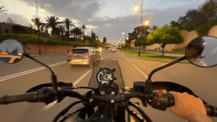 Evening motorcycle ride through Marrakesh captures city landmarks