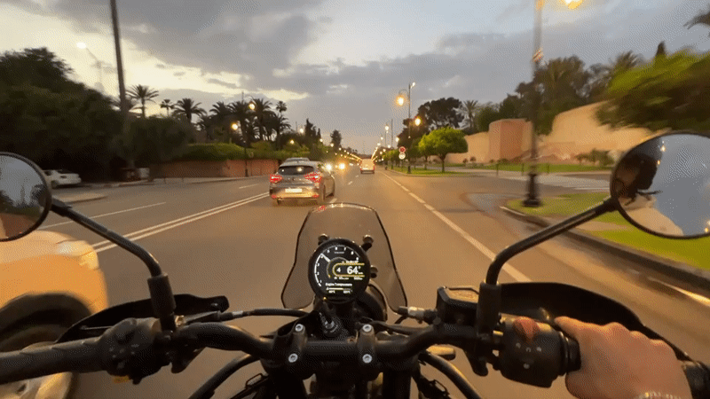 Evening motorcycle ride through Marrakesh captures city landmarks