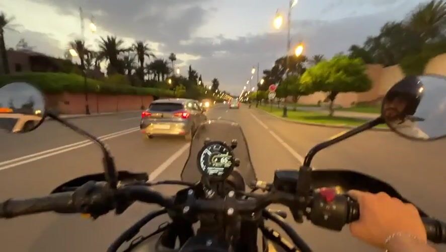 Evening motorcycle ride through Marrakesh captures city landmarks