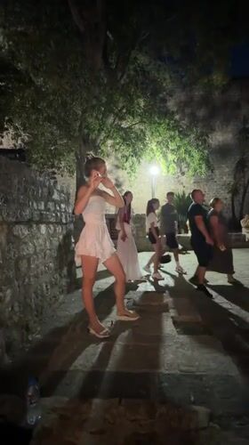 Live flute and evening crowds in Budva's old town