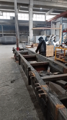 Welder constructs steel frame in Montenegro industrial workshop