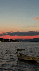 Fethiye waterfront at dusk, sunset to string lights