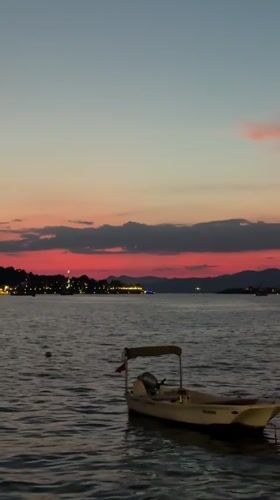 Fethiye waterfront at dusk, sunset to string lights
