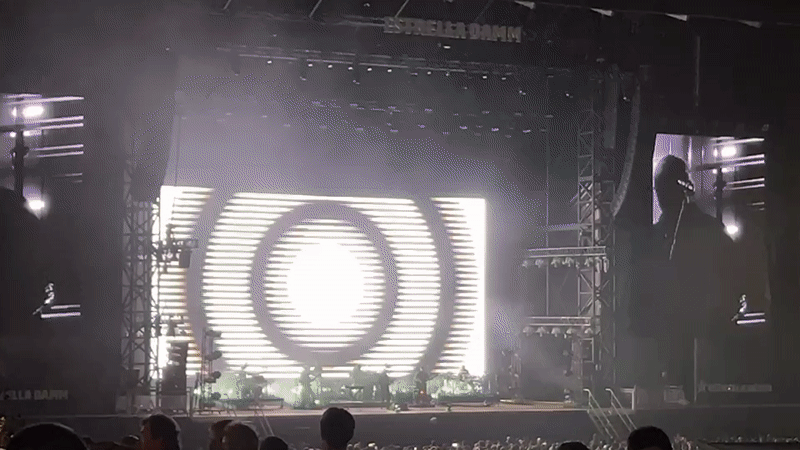 Outdoor concert with large screens and crowds in Porto