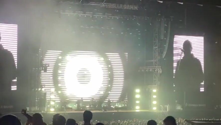 Outdoor concert with large screens and crowds in Porto