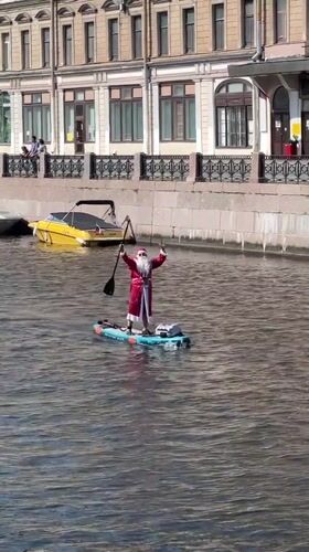 Paddleboards fill a Saint Petersburg canal on a summer morning
