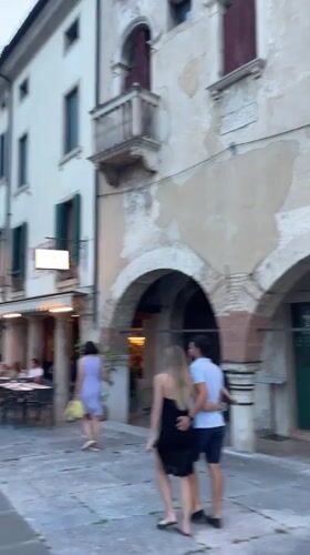 Evening stroll through a Vittorio Veneto piazza