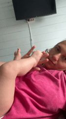Mother, baby and dachshund share quiet domestic moments in Russia