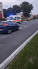 Emergency ambulance speeds through Stezzano with flashing lights