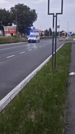 Emergency ambulance speeds through Stezzano with flashing lights