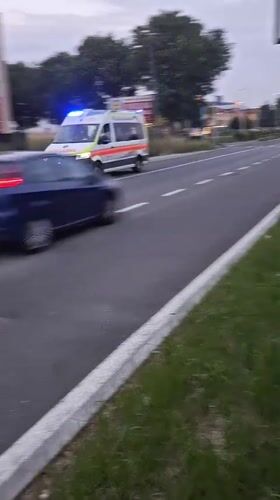 Emergency ambulance speeds through Stezzano with flashing lights