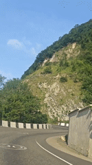 Car navigates winding mountain road in Sochi