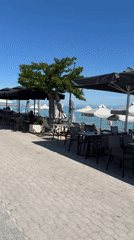 Morning scene at seaside restaurant patio in Greece