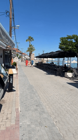 Morning scene at seaside restaurant patio in Greece