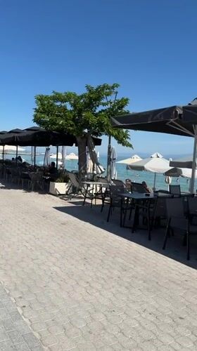 Morning scene at seaside restaurant patio in Greece