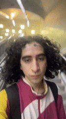 Commuter travels through Buenos Aires subway stations during evening hours
