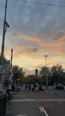 Evening dusk scenes captured across Amsterdam streets and canals
