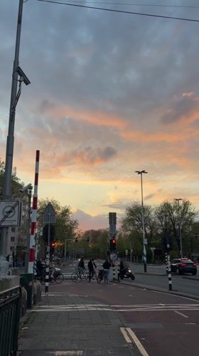 Evening dusk scenes captured across Amsterdam streets and canals