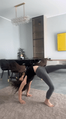 Child practices gymnastics at home, commercial area filmed