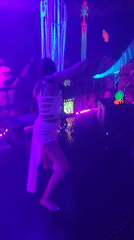 Nightclub scene with dancing, live music captured in Blahbatuh