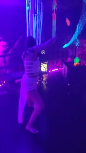 Nightclub scene with dancing, live music captured in Blahbatuh