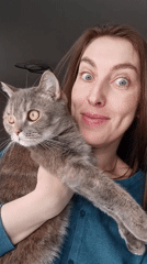 Woman shares quiet domestic moments with cat, child in Chaikovsky