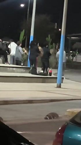 Nighttime street music performance draws crowd in Arica, Chile