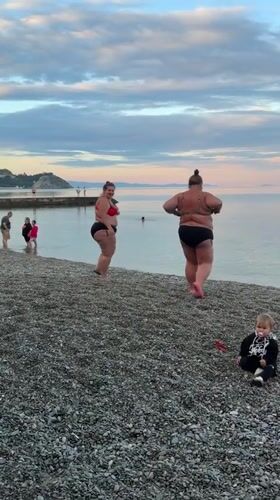 Beachgoers enjoy summer afternoon at Partenit, Ukraine seaside