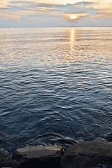 Sunset documented over Lhokseumawe coast with boats and cats