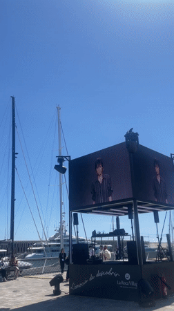 Outdoor stage setup observed at Barcelona marina waterfront