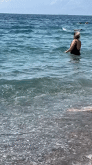 Crowded pebble beach day on the Antalya Mediterranean coast