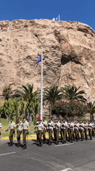 Military parade with armed soldiers marches through Arica, Chile