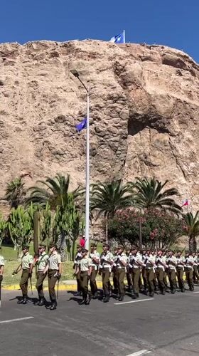 Military parade with armed soldiers marches through Arica, Chile