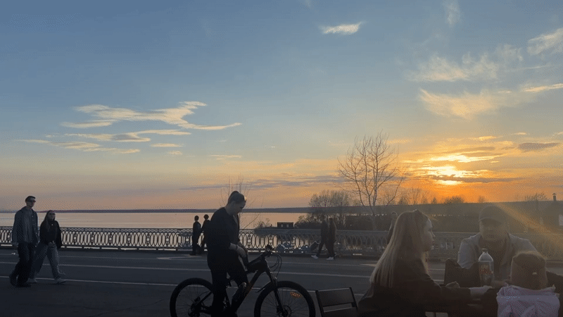 Sunset gathering with bicycles at Kama River embankment