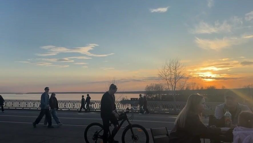 Sunset gathering with bicycles at Kama River embankment