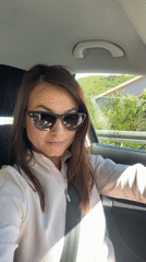 Woman drives through Budva Montenegro morning commute