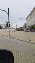 Morning drive captured on cobblestone street in Sofia