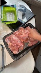 Home cook prepares chicken dish in Moscow kitchen