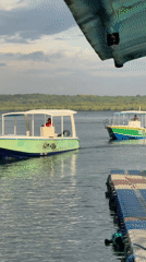Boats navigate clear waters near Nusa Penida coastline