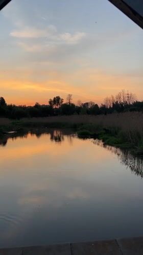 Families enjoy sunset riverside recreation in Klin, Russia