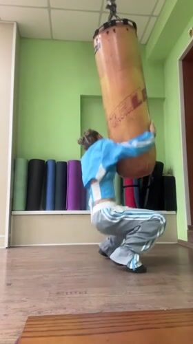 Woman films acrobatic workout session at Abakan dance studio
