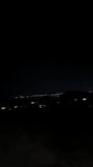 Nighttime city lights observed from elevated position in Ruse