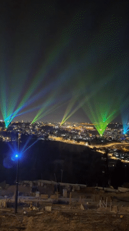 Blue and green lasers light up Jerusalem's night sky