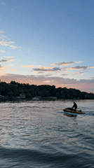 Solo jet skier rides yellow watercraft near Vatra, Moldova